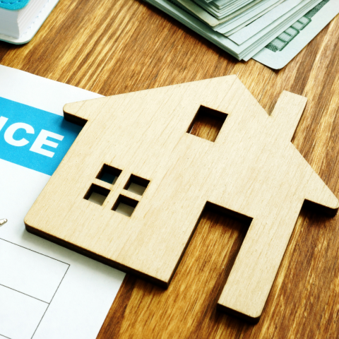 A wooden cutout of a home.