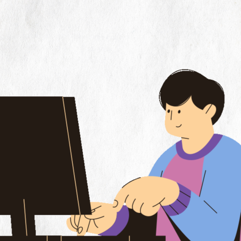 Teen coding at a computer.