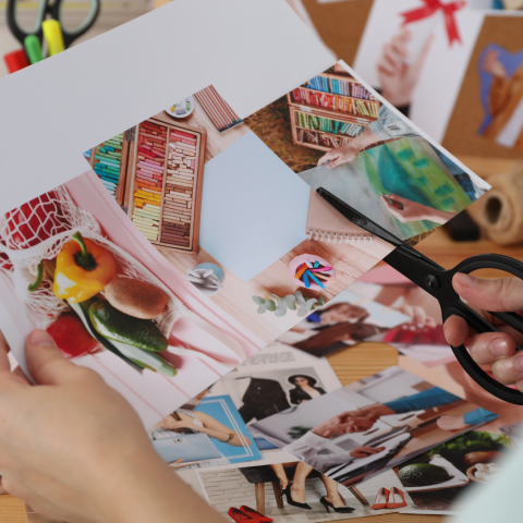 Someone cutting out snippets from a magazine.