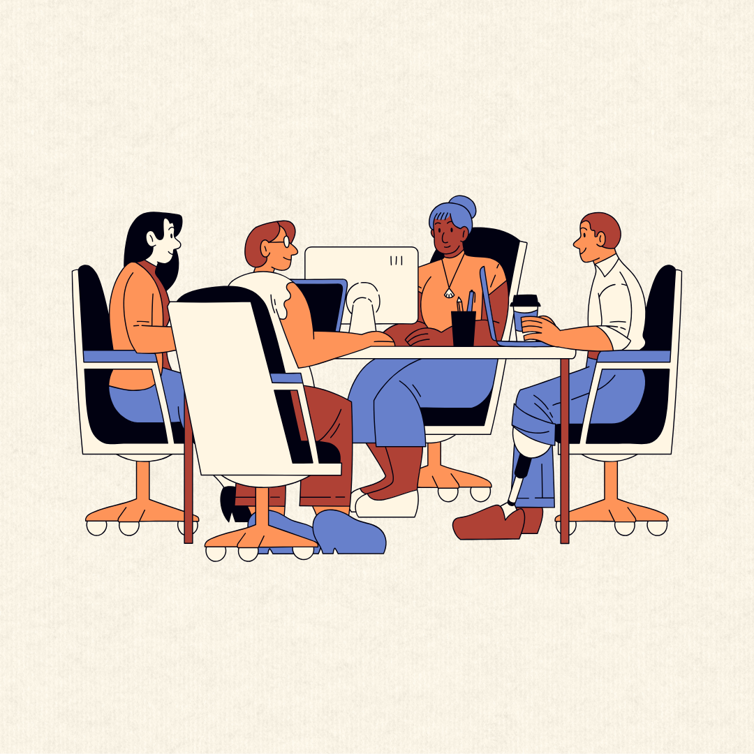 A group of people sit at a table working on a project together